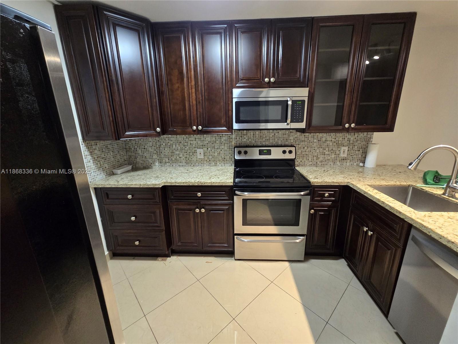 SOUGHT AFTER 2ND FLOOR CORNER UNIT - SUBSTANTIALLY REMODELED WITH A BEAUTIFUL KITCHEN - STAINLESS STEEL APPLIANCES - CERAMIC TILES THROUGHOUT - HURRICANE SHUTTERS - EXTRA WINDOW IN MASTER BATHROOM - QUIET LOCATION - GREAT COMPLEX HAS 24 HOUR GATED SECURITY - CLUBHOUSE - GYM -SAUNA -STEAM ROOM - ENTERTAINMENT ROOM - 3 POOLS - CAR WASH & MUCH MORE - ALL AGES WELCOME - ONLY 12 MINUTES FROM THE BEACH & CLOSE TO ALL AMENITIES- PRICED RIGHT - WATER, WASTE, TRASH AND EXTENDED CABLE INCLUDED IN THE MAINTENANCE - VACANT & EASY TO SHOW - NEW CEILING FANS - THE PROPERTY IS BEING FRESHLY PAINTED.