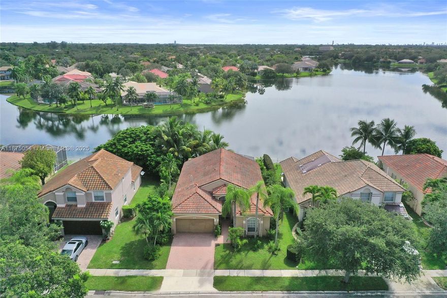 Stunning Teakwood completely remodeled/modernized. Open floor plan lay-out connecting all main living areas overlooking to one the best lake views in the community. Upgraded front door, tile & laminated floors, kitchen cabinets, stainless steel appliances, remodeled bathrooms with new sinks, sunken tub, faucets, lighted mirrors, glass door showers, tiled walls, lights, wall paneling, custom built in mirrors, closet doors, built ins and more! Patio has an oversized screened enclosure with paver floors, built in grill with natural gas connection available, outside of primary bedroom has a built in cozy gazebo surrounded by overgrown trees providing lots of privacy to enjoy this fantastic lake views. Clubhouse includes pool, tennis, pickleball, gym, ball room, playground, security & more!