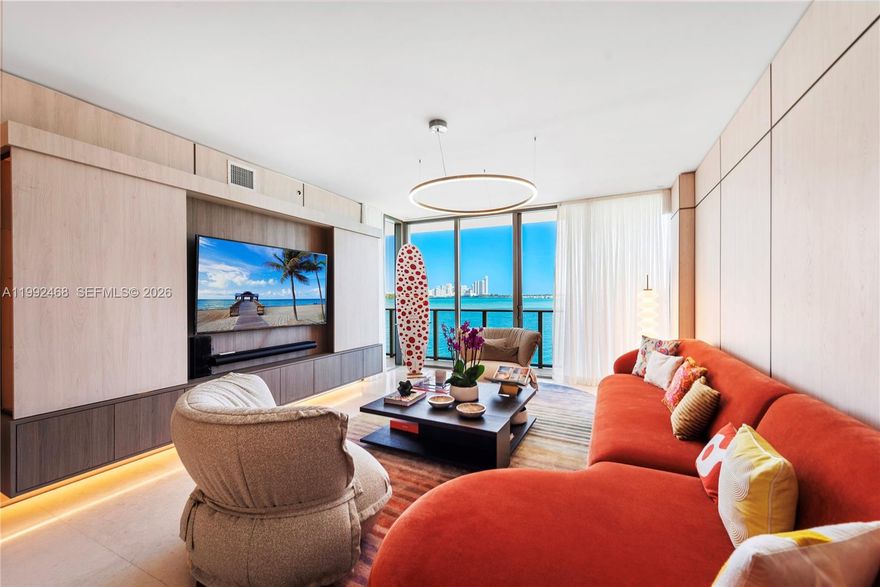 Exceptional fully upgraded and furnished waterfront residence, masterfully curated by a world-class designer. This sophisticated 3-bedroom layout features a stunning primary suite facing the bay, complete with a private terrace that captures serene water views. The second and third bedrooms open onto an expansive, one-of-a-kind terrace of over 300 sq ft, seamlessly blending indoor and outdoor living. A versatile studio/library and TV room add both functionality and refined comfort. Equipped with a spacious fully-equipped laundry room. 

Every detail has been thoughtfully designed, showcasing iconic interiors, top-of-the-line appliances, and high-end European bathrooms. The primary bathroom offers a spa-like experience with a generous soaking tub and separate glass-enclosed shower. Spacious walk-in closets and custom lighting fixtures further enhance the residence’s elevated aesthetic.

Located within a brand-new boutique tower by renowned developer Ugo Colombo, the building reflects impeccable construction quality and timeless design. Residents enjoy a curated selection of luxury amenities, including a rooftop pool with breathtaking bay views, private marina, full-service spa and wellness center, concierge, and valet parking. The highest luxury condominium in the area.

Ideally positioned in the quiet, safe, and exclusive enclave of Bay Harbor Islands, just moments from Bal Harbour Shops and the beach.

Private marina slip available at an additional cost.