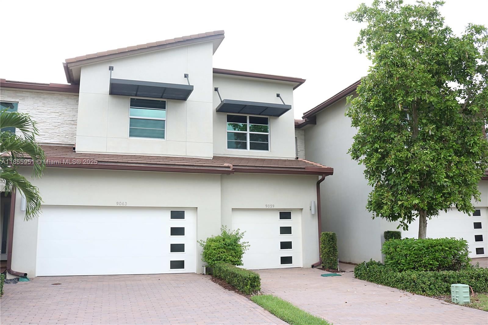 Beautifully maintained 3-bedroom, 2.5-bath townhome offering modern style and serene lake views. This spacious home features a sleek, updated kitchen with a large island—perfect for entertaining or casual dining. Enjoy peace of mind with impact windows and a newer 2018 roof. The open-concept layout flows effortlessly to the living and dining areas, while upstairs you'll find generously sized bedrooms and ample storage. Relax on the patio while taking in the tranquil lake views. Located in a gated community with fantastic amenities—this home has it all!