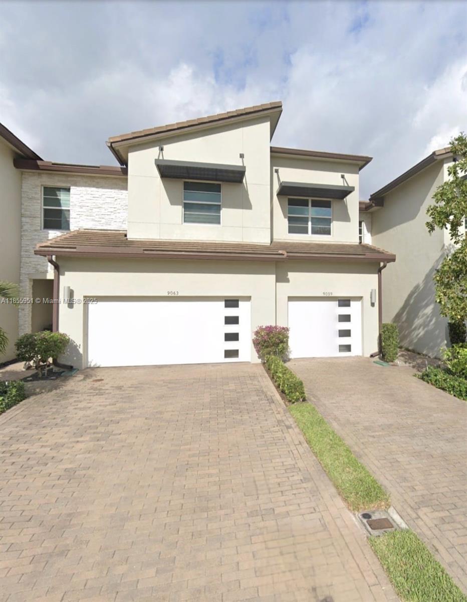 Beautifully maintained 3-bedroom, 2.5-bath townhome offering modern style and serene lake views. This spacious home features a sleek, updated kitchen with a large island—perfect for entertaining or casual dining. Enjoy peace of mind with impact windows and a newer 2018 roof. The open-concept layout flows effortlessly to the living and dining areas, while upstairs you'll find generously sized bedrooms and ample storage. Relax on the patio while taking in the tranquil lake views. Located in a gated community with fantastic amenities—this home has it all!