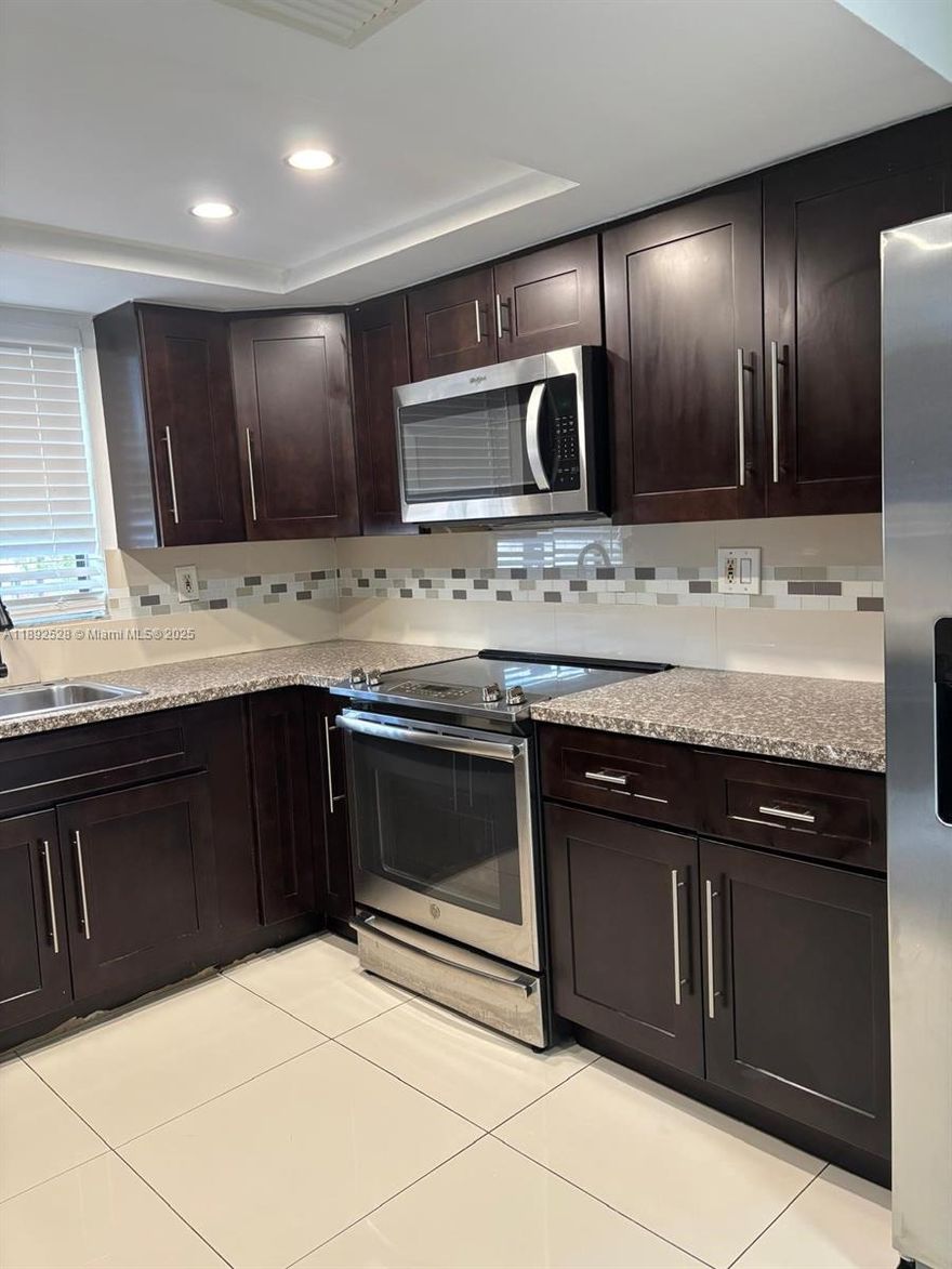 Spacious and fully updated 2-bedroom, 2-bath condo located on the second floor. Features elegant porcelain floors throughout, in-unit washer and dryer, and has been freshly painted—ready for immediate move-in! The property includes two assigned parking spaces for your convenience. Enjoy a prime location within the sought-after community of Terranova, just minutes from FIU, Dolphin Mall, major highways (836), and a great selection of restaurants and shops nearby. Don’t miss this opportunity to live in a well-maintained and centrally located condo!