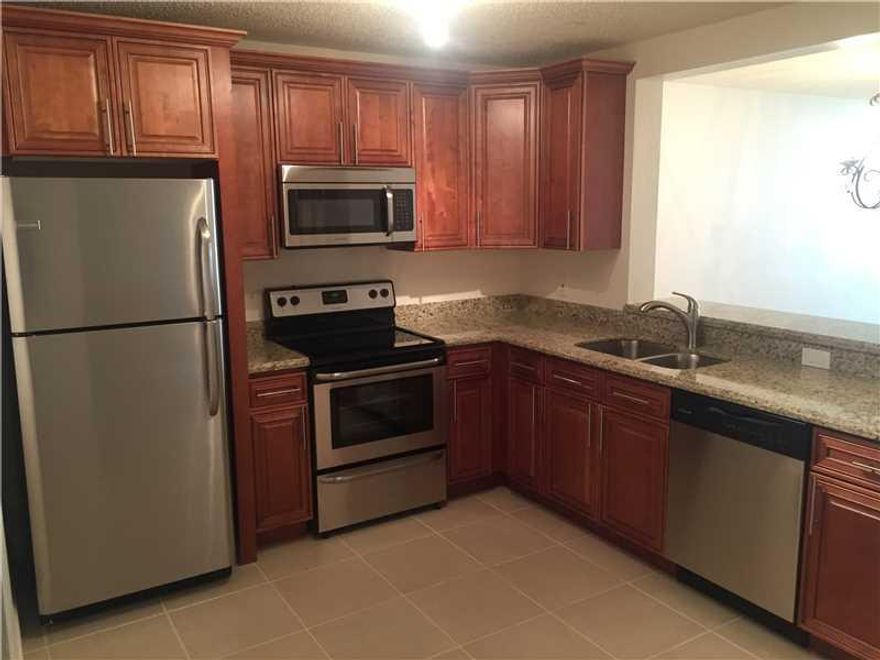 Completely remodeled 2/2 villa in heart of Boca Raton. Live an active lifestyle without membership fee. New tiles, freshly painted, all new SS appliances w/ granite & wood cabinetry. New bath vanities, toilets. New garage door operator, new windows, new b linds, new light fixtures. Washer/dryer inside. Very open bright and neutral colors, new hardware, nothing to do but enjoy. Sit outside on screened patio and enjoy nature. Beautiful active clubhouse and pool. You must see this one. Excellent workmanship.