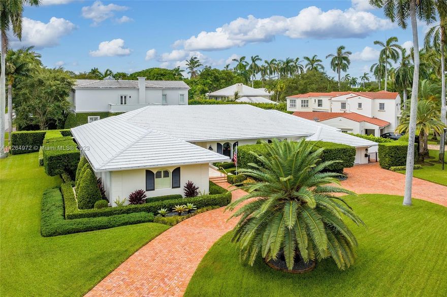 Live in one of the most coveted islands in Miami Beach, La Gorce Island. Incredible opportunity to own a home on private, guard-gated La Gorce on a 13,750 square foot corner lot. Boasting 4 bedrooms, 5 full bathrooms & 1 half bathroom, double height ceilings, a heated & chilled, 44’ long saltwater lap pool, full house generator, air conditioned 2 car garage, 6 AC zones, natural light throughout, marble floors & verdant, manicured landscaping. The floorplan allows for a great flow through of spaces w/ views throughout overlooking the lush outdoor greenery & beautiful pool. This 5,717 sf home features spacious bedrooms, walk-in closets, formal dining room & plenty of space for entertaining. Located in close proximity to the beach, world-class restaurants & all that Miami Beach has to offer.