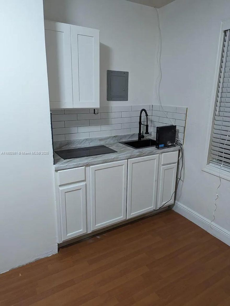 Desirable studio apartment located in the lovely Little Gables neighborhood. Unit offers hard wood floors, hurricane impact windows, an open layout & custom cabinetry. Bathroom is updated with modern fixtures and sleek design. ELECTRICITY INCLUDED! Minutes away from major highways and International Airport!