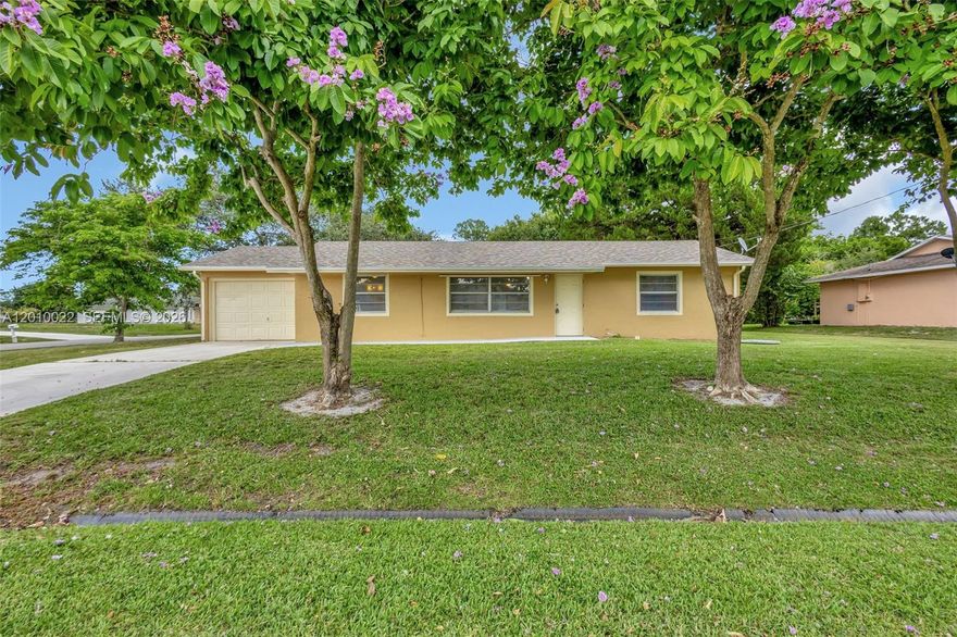 Welcome to this beautifully updated 3-bedroom, 2-bath home on a spacious corner lot. Enjoy the modern feel of newly installed vinyl flooring and granite kitchen countertops. The open layout offers plenty of space for both relaxing and entertaining. Step outside to a yard featuring a variety of trees, including a mango tree, perfect for gardening enthusiasts. Located in a desirable neighborhood with convenient access to major highways (I-95 & Turnpike), shopping, dining, and everyday essentials. A new roof installed in 10/2024 with a 10-year transferable (as of install date) workmanship warranty and a new A/C unit installed in 10/2024 provide added comfort and peace of mind.