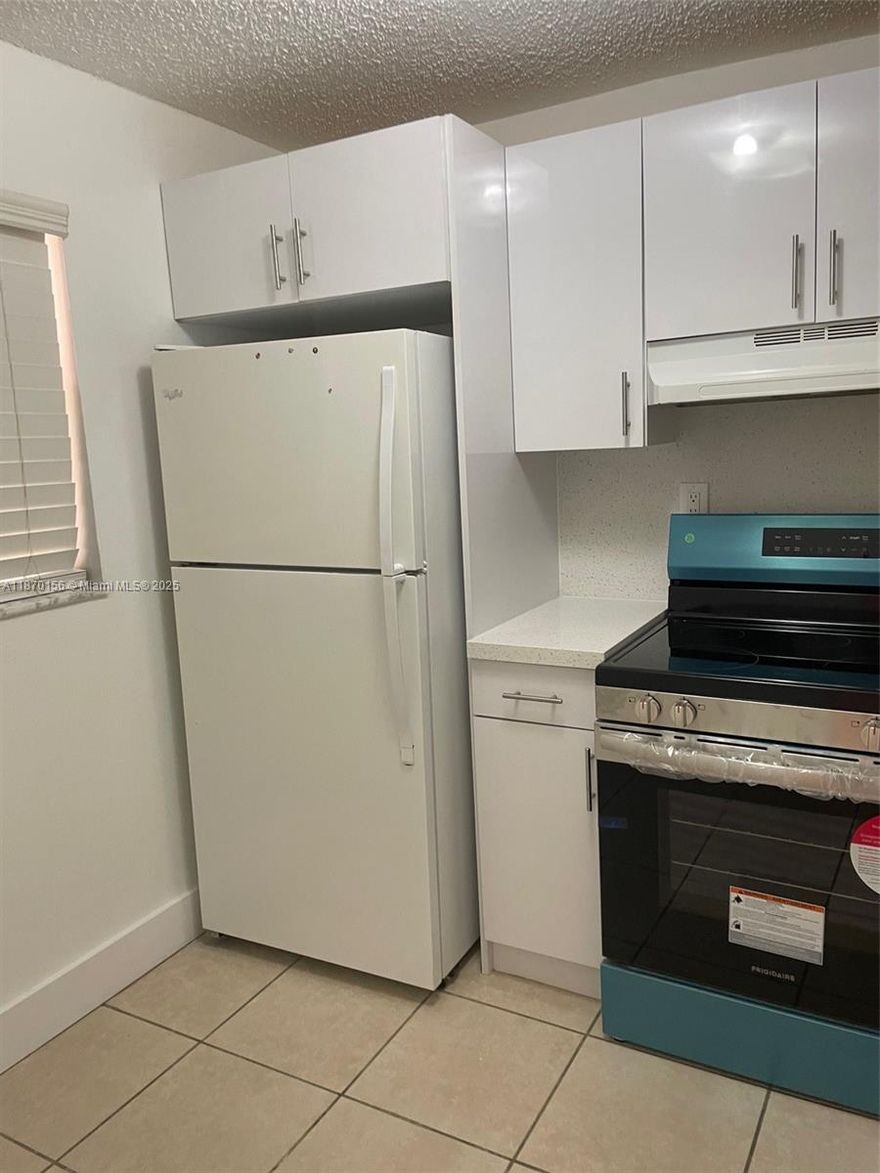 TWO BEDROOMS TWO BATH APARTMENT, FIRST FLOOR, REMODELED.  NEW KITCHEN, STAINLESS STEEL APPLIANCES, CENTRAL AIR, TILE FLOORS, GATED COMMUNITY  CENTRALLY LOCATED NEAR SHOPPING AND SCHOOLS