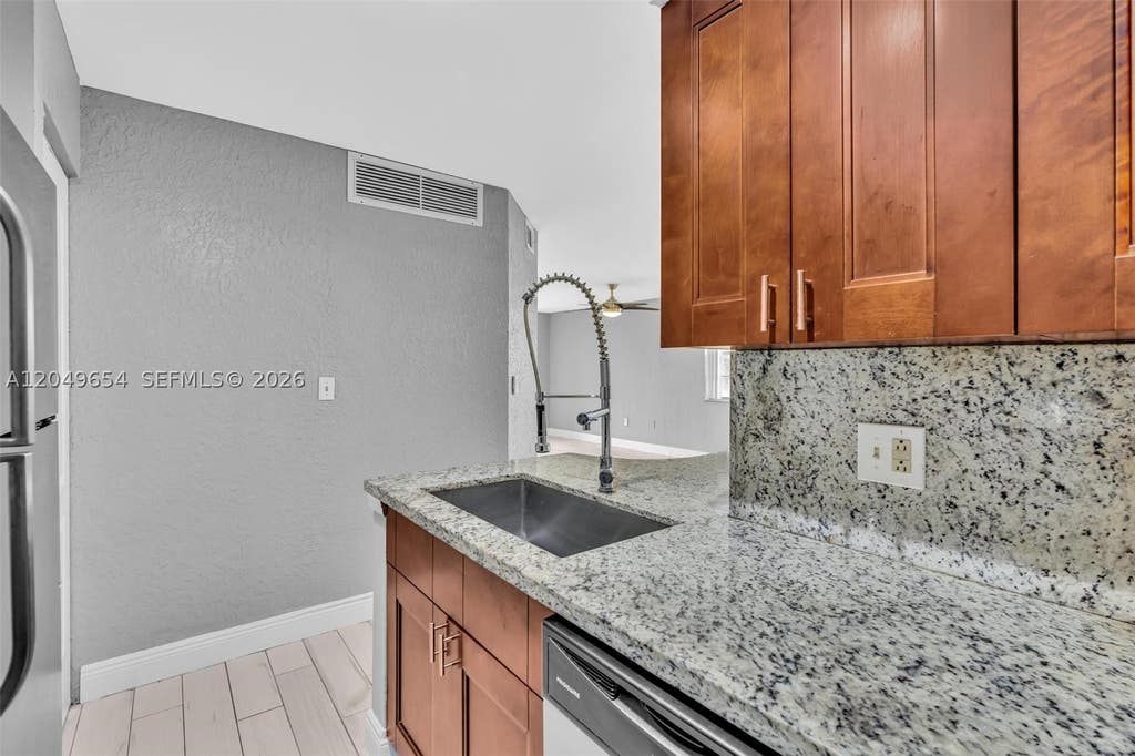 Photo of 2851 N Oakland Forest Dr #111, Oakland Park, FL 33309 (MLS # A12049654)