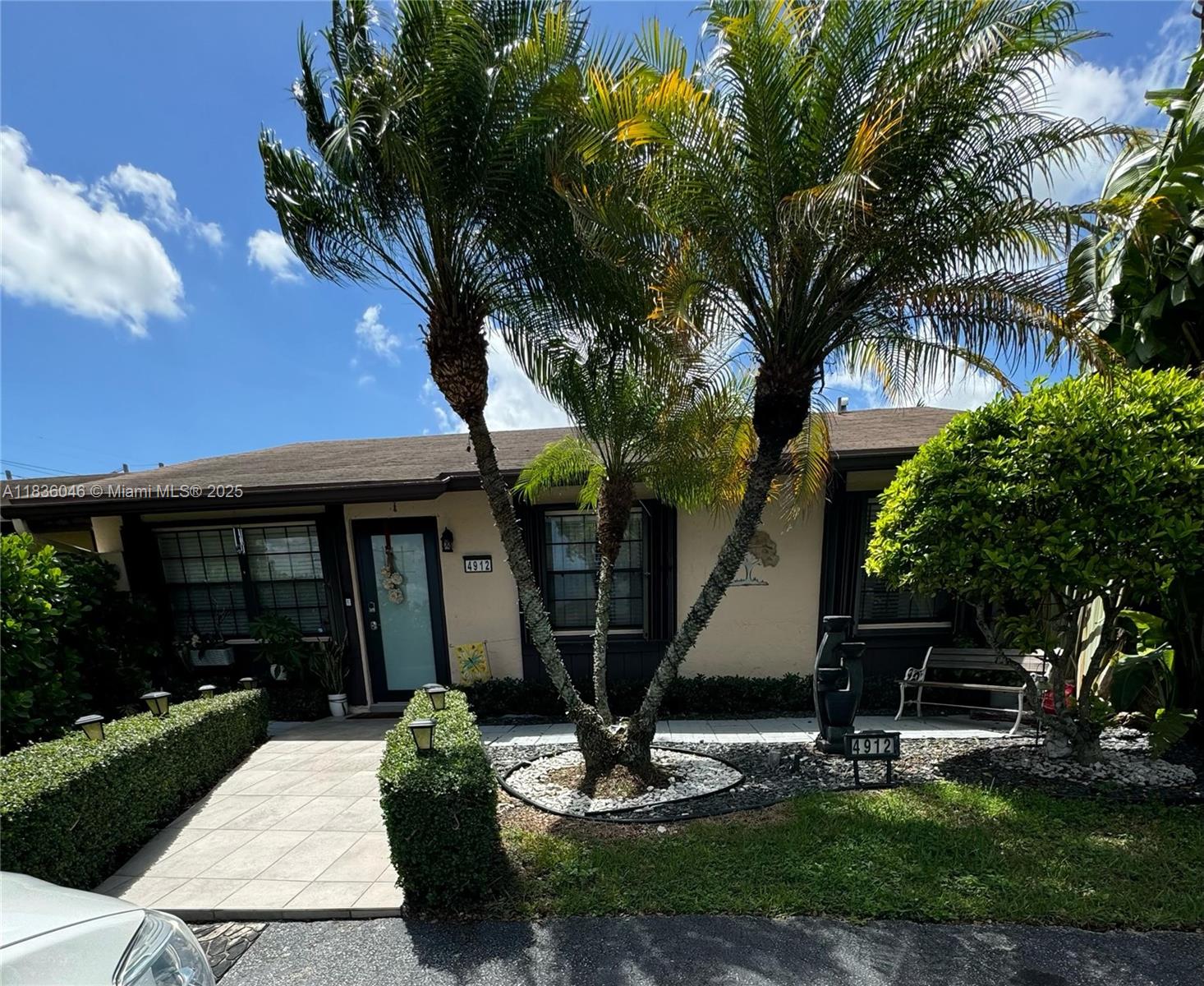 Beautifully maintained 3-bedroom, 2-bathroom villa/townhome, fully tiled and nestled in the tranquil Woodbury community. This inviting home offers a bright, open layout with a spacious living room, dedicated dining area, and a sleek modern kitchen with stainless steel appliances. Enjoy the ease of an in-unit washer and dryer, protective accordion shutters, and a warm, paved backyard (fully fenced and covered) ideal for memorable gatherings and weekend BBQs. A practical storage shed adds extra value. The property includes a private driveway for two vehicles, plus convenient guest parking within the community. Perfectly located near shopping, dining, top-rated schools, hospitals, and major highways, this home combines everyday comfort with unbeatable convenience.