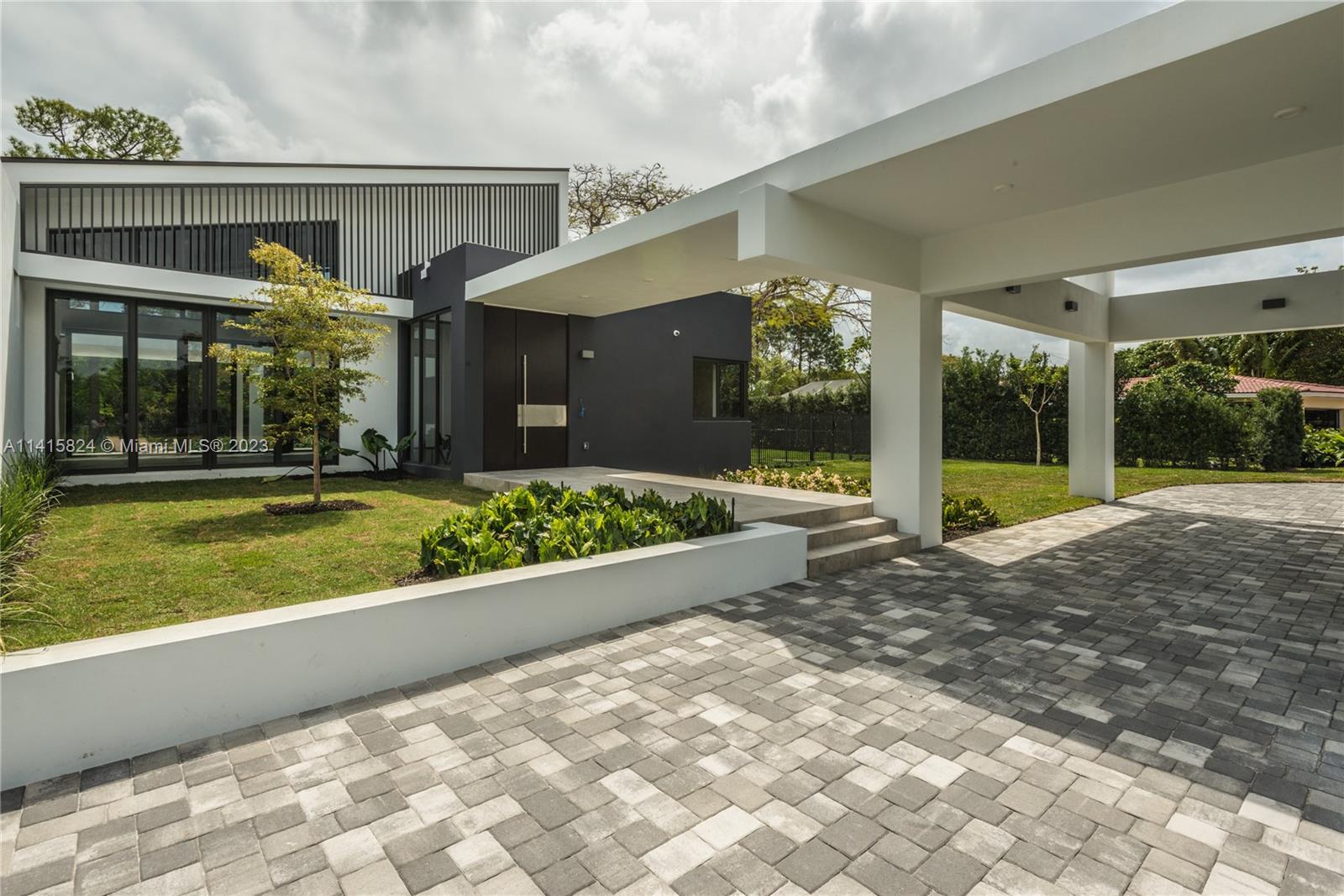 Welcome to a contemporary amazing custom design home, located in the Sunset View neighborhood. One-story design consisting of 5 bedrooms and 5 bathrooms. Sitting in an impressive 36,000 lot with mature landscape designed garden. The 18’ x 28’ great room has a sloped ceiling, Perfect for entertaining, opens onto a large covered patio and extra large pool area. Adjacent to the great room is the kitchen/family room area, which carries along the design of the ceiling, reaching a height of almost 18’. This great property, is equipped with the best water purification system and a Generator. Mature and beautiful landscape. Security camera system with remote monitoring. High impact windows. Roatan designed solid wood impressive front door.