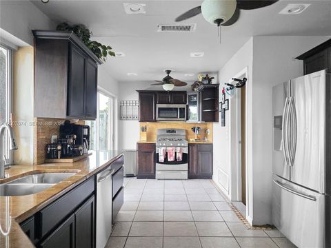 Photo of 11661 NW 31st Pl, Sunrise, FL 33323 (MLS # A12007074)