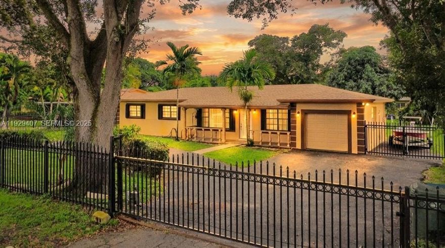 This beautifully well-maintained house on a rare 20,000sqft lot is ready for its next owner! Located in highly desirable Biscayne Gardens neighborhood nestled behind an electric gated fence you'll enjoy privacy and security. This home features 4 spacious bedrooms and 3 full bathrooms including an oversized master bedroom that offers excellent potential to be converted. Garage space for car, storage or workshop. Oversized backyard for entertaining and enough space for your dream pool, parking boats, RV, or creating your private oasis! Property features 2020 shingled roof, 2022 water heater, new AC, exterior lighting! Don't miss out on this opportunity to own this incredible property!!
