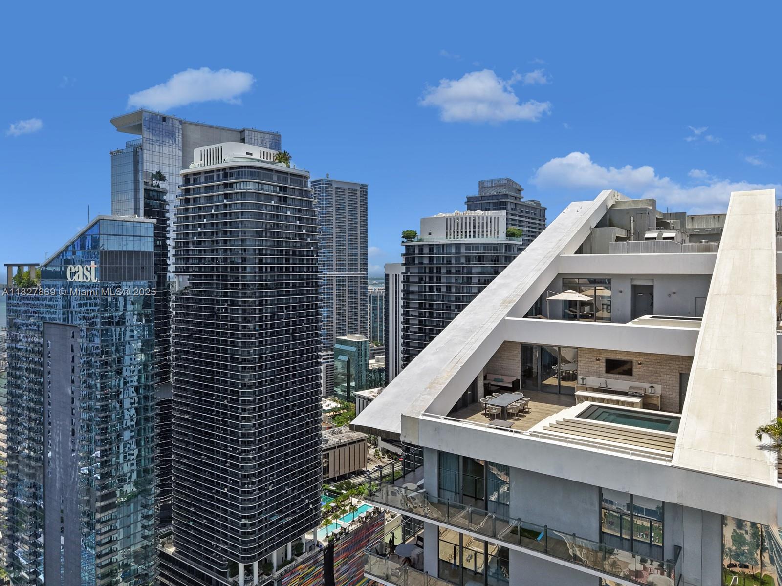 Introducing the only two-story, east-facing penthouse at Rise in Brickell City Centre— This exceptional 4 BED/5.5 BATH corner residence over 3,600 Interior SFT boasts 5 private terraces and over 3,000 SF of outdoor living, including a rooftop pool, summer kitchen, and upper-level hot tub. Custom-designed for seamless entertaining with panoramic bay and skyline views from every angle. Highlights include a maid's quarters with full bathroom and separate entrance, custom wine cellar, hidden speakeasy-style bookshelf door, 3 parking spaces, and $250K+ in luxury upgrades. With a luminous open floor plan and resort-style amenities, Rise is a full-service high-rise steps from world-class dining, shopping,
and entertainment.