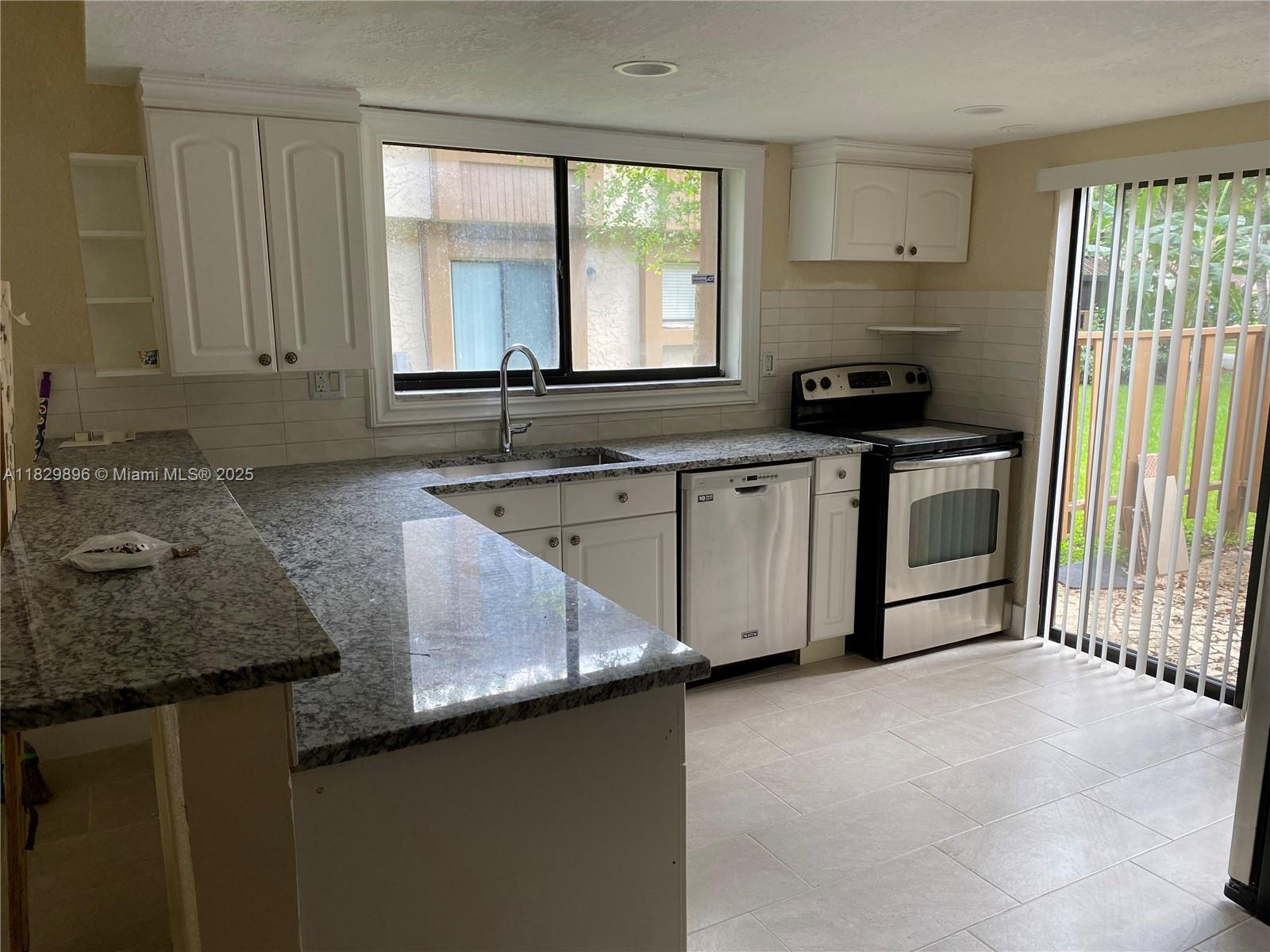 Impeccable two stories townhouse with 3 bedrooms and 2 1/2 bathrooms in the city of Plantation. This unit is 1,500 sq ft. with living room, dining room, breakfast area, master bedroom with master closet, storage closet and laundry room with washer and dryer. First floor is ceramic tile and stairs and second floor are wood floors. The kitchen has wood cabinets, granite countertops and stainless steel appliances. Both SGD are impact glass. It has two assigned parking spaces and a back terrace. Unit is completely painted. The rental of this property requires association approval. It's available to show and for immediate rental. Tenants will need to pay the prorated days of the first month, a security deposit and the last month. CALL LISTING AGENT TO SCHEDULE A SHOWING.