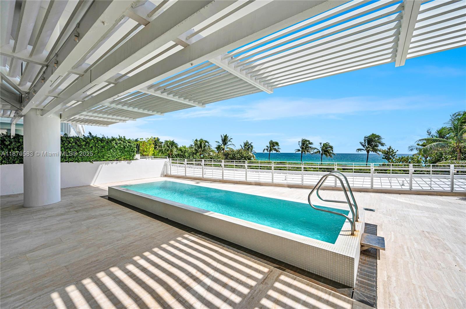 Experience the LEGENDARY FOUR SEASONS LIFESTYLE from this one-of-a-kind OCEANFRONT CORNER RESIDENCE at The Surf Club. Designed by Pritzker Prize-winning architect Richard Meier, this extraordinary corner home features 5 bedrooms, 6.5 baths, family/media room, and expansive living spaces with custom stone details throughout. Highlight with a spectacular 2,000 SF oceanfront terrace with private pool, perfect for seamless indoor-outdoor entertaining. A Boffi-designed kitchen with quartz countertops and top-tier appliances anchors the open living and dining areas. Smart home automation with Lutron lighting, integrated sound, and a 2 car temperature controlled garage. Enjoy Four Seasons’ art of hospitality—24-hr concierge, dining, housekeeping—plus 4 pools, fitness center, spa, fine dining.