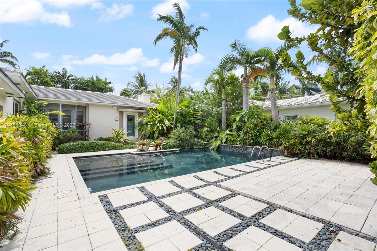 Perfectly situated on the best part of LaGorce Drive, one of the jewels in Miami Beach’s crown, you will find this fabulous 3 bedroom, 3 bathroom 2,311 square foot home that is ready for your personal touch! Open the gate to the private courtyard entry and you are in a tropical garden with a lovely pool and pavered walkway to the front door. Inside find hardwood and terrazzo floors and 3 spacious living or dining areas that can be used for either formal or casual entertaining and living. The 3 bedrooms each have their own bathrooms and all have spacious walk-in closets. This is the opportunity of a lifetime on LaGorce!