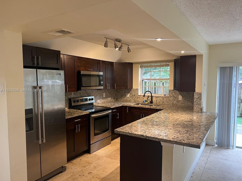 Photo of 4979 SW 123rd Ter, Cooper City, FL 33330 (MLS # A11928598)