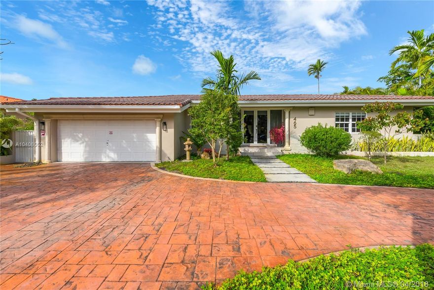 Opportunity knocks for this renovated ranch in central location of idyllic Miami Shores. Enjoy easy living, 4B/2.5BA, with roomy 2,826 Total SF and a big, very private 11,050 sq. ft. lushly landscaped lot. Move right in with no worries with impact windows/doors, skylights, high-end security system, and even a generator! Entertain friends and family with a huge eat-in gas range kitchen with island and tons of storage! Split floor plan with nice master bath, double sinks, separate tub and shower. Covered porch for dining "alfresco" with private backyard, circular driveway, with 2-car garage with lots of storage. Immaculate.