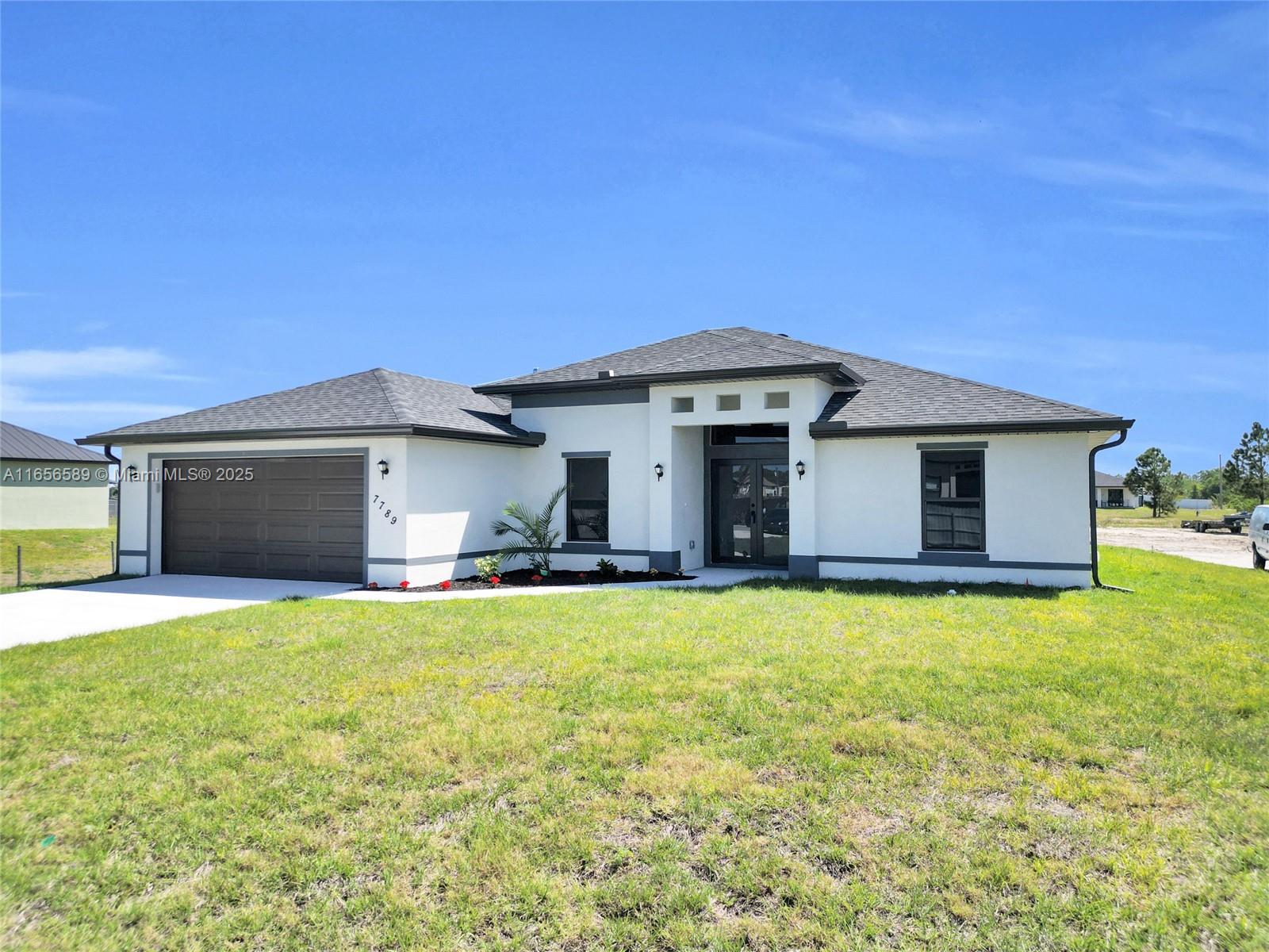 Your Country Oasis Awaits! 4 BR, 3 BA plus den home on 1.25 acres is ready for its new owner. 2 Master Suites, luxury Kitchen with granite countertops, center island, and stainless-steel appliance package. Primary Master Suite offers spacious walk-in closet and his-and-her sinks. Relax on the screened lanai with pavers, outdoor kitchen with sink and space for a fridge, room for pool, detached garage, or barn on this expansive lot. The front yard features a metal fence with two gates, and there's ample room to park semi-trucks or other large vehicles. Barnyard animals are welcome (some restrictions apply). Easy access to SR80,SR82, Seminole Casino, and the airport. The seller will generously contribute $7,500 toward closing costs, making this dream home even more attainable!