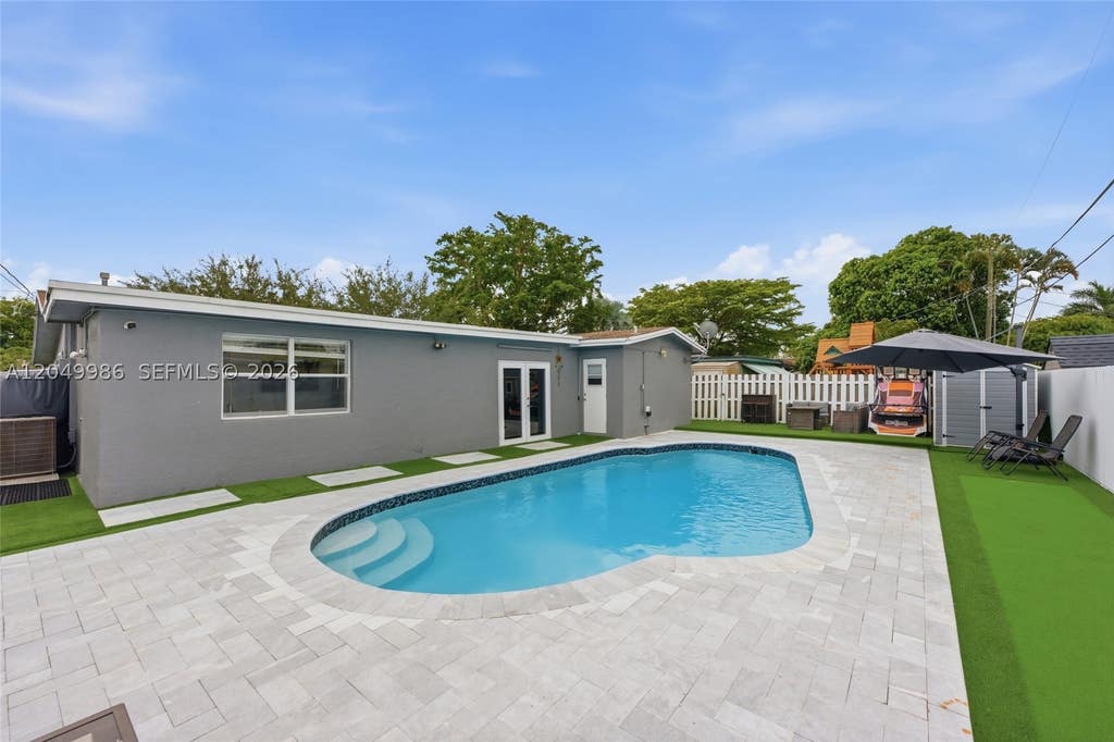 Photo of 9771 NW 24th Pl, Sunrise, FL 33322 (MLS # A12049986)