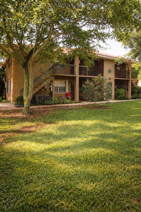 Photo of 10480 NW 8th St #201, Pembroke Pines, FL 33026 (MLS # A11985422)