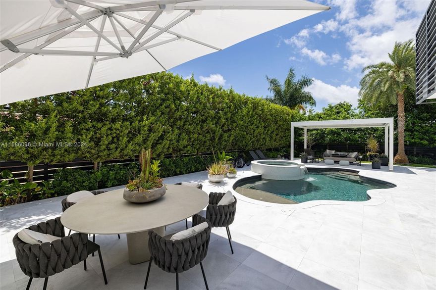 Welcome to the exclusive Seven Isles neighborhood. This home has been designed w/ the utmost attention to detail & a focus on providing a luxurious and comfortable living experience. From the curated design by a noted NYC Design group to the top-of-the-line kitchen appliances & Control4 home automation system, every aspect has been carefully crafted to enhance convenience & modern living.The outdoor space w/ Cararra Marble pool decking & a powered louvered shade structure sounds like an oasis where one can unwind & entertain guests in style. Primary bedroom features vaulted ceilings, custom Poliform Italian closet, balcony overlooking the pool offers a private sanctuary within the home. This residence embodies luxury, sophistication & tranquility, making it a truly desirable haven