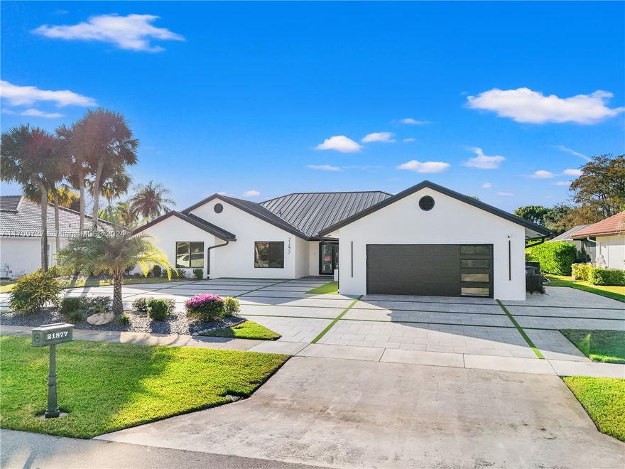 Welcome to an extraordinary opportunity on one of the most desired streets in the Boca Woods Country Club! This exceptional 3-bed, 2.5-bath home with a den/office is nestled on a spacious 14,257 sqft lot located on the signature hole of the Woods golf course. With a brand-new metal roof, impact windows and doors, lush landscaping, and a refinished & heated, saltwater pool - no detail has been overlooked. Inside, enjoy porcelain tiles throughout, while new pool pumps, a insect spray system, and a new sprinkler system elevate the experience. The community offers unparalleled amenities, including but not limited to; new pickleball & tennis courts, 2 golf courses, and a stunning new clubhouse featuring game rooms, boardrooms, & a full-service spa and gym. This is luxury living at its finest!