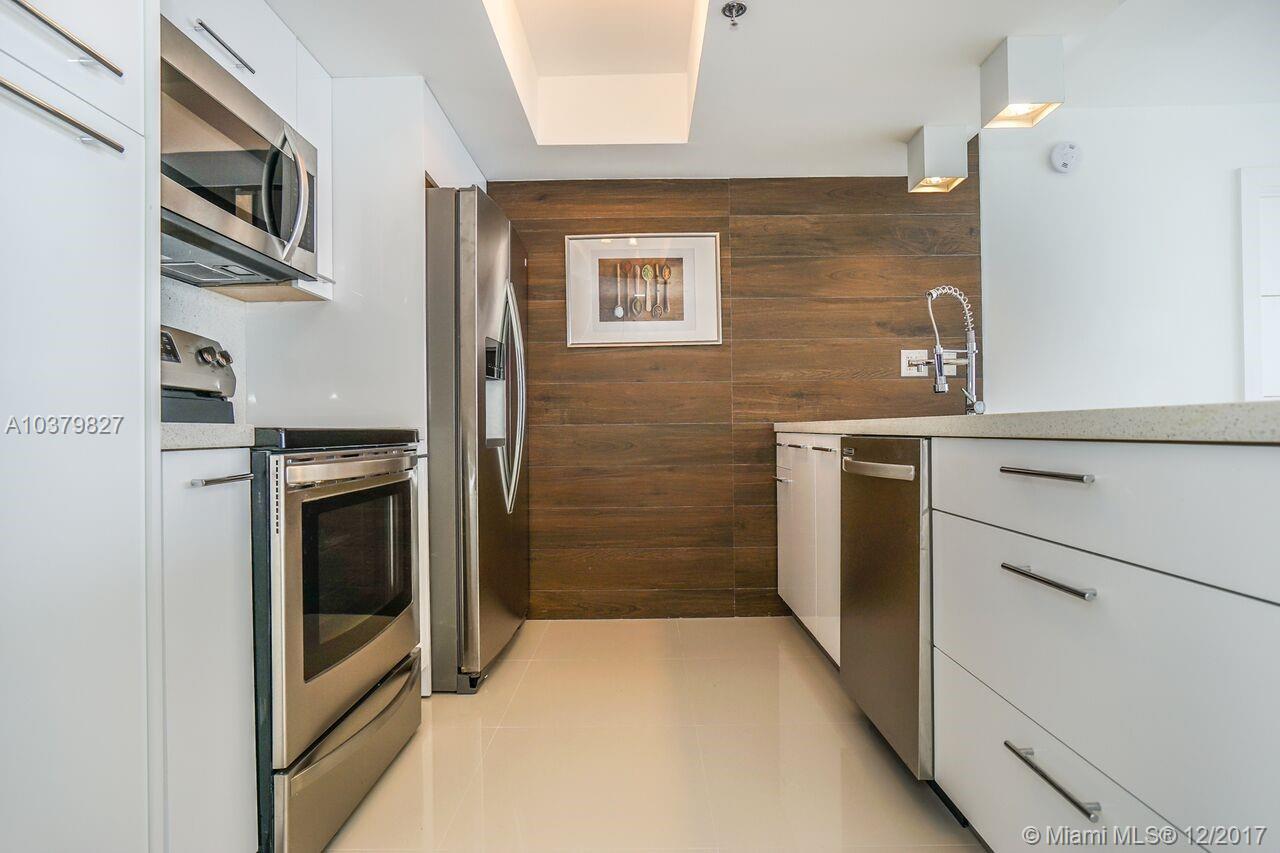TODAY'S BEST UNIT AT THE GRANDVIEW PALACE. Beautiful designer's dream 2/2 condo, with 24x24 Italian imported rectified porcelain throughout, an amazing open kitchen with quartz counter tops & back splashes, a decorative wood-like porcelain wall, large custom cabinetry, and top of the line appliances. Both rooms with open custom made closets and electrical "black out" shades. Both bathrooms are simply a designer's work of art, just as the lighting in every single room. Amenities include an impressive pool deck with an Olympic swimming pool, a kids pool, pic nick area and a 10 guests Jacuzzi. Boat slip available for rent at the best gym you will find in the area. YOU WILL BE THE 1ST ONE USING IT! THIS IS, DEFINITELY, WHAT YOU ARE LOOKING FOR!