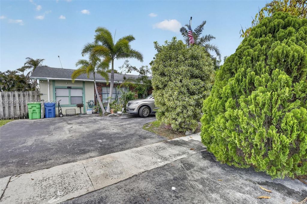 Photo of 9131 NW 31st Pl, Sunrise, FL 33351 (MLS # A12014977)