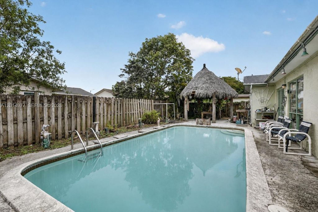 Photo of 9131 NW 31st Pl, Sunrise, FL 33351 (MLS # A12014977)