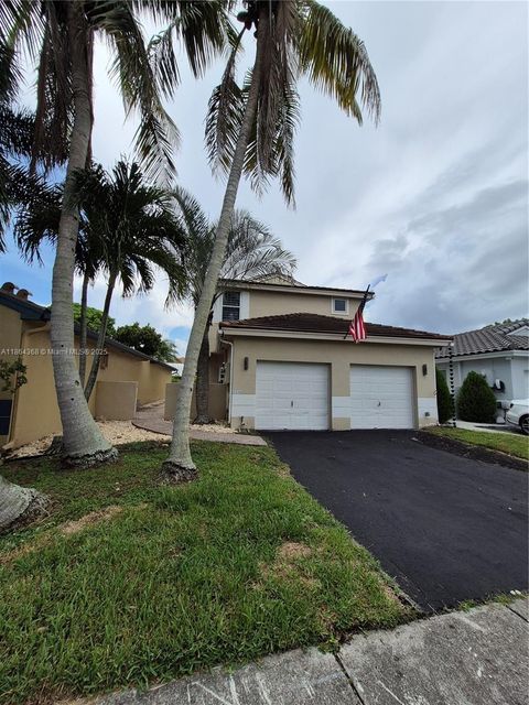 Photo of 2176 NW 184th Way, Pembroke Pines, FL 33029 (MLS # A11864368)