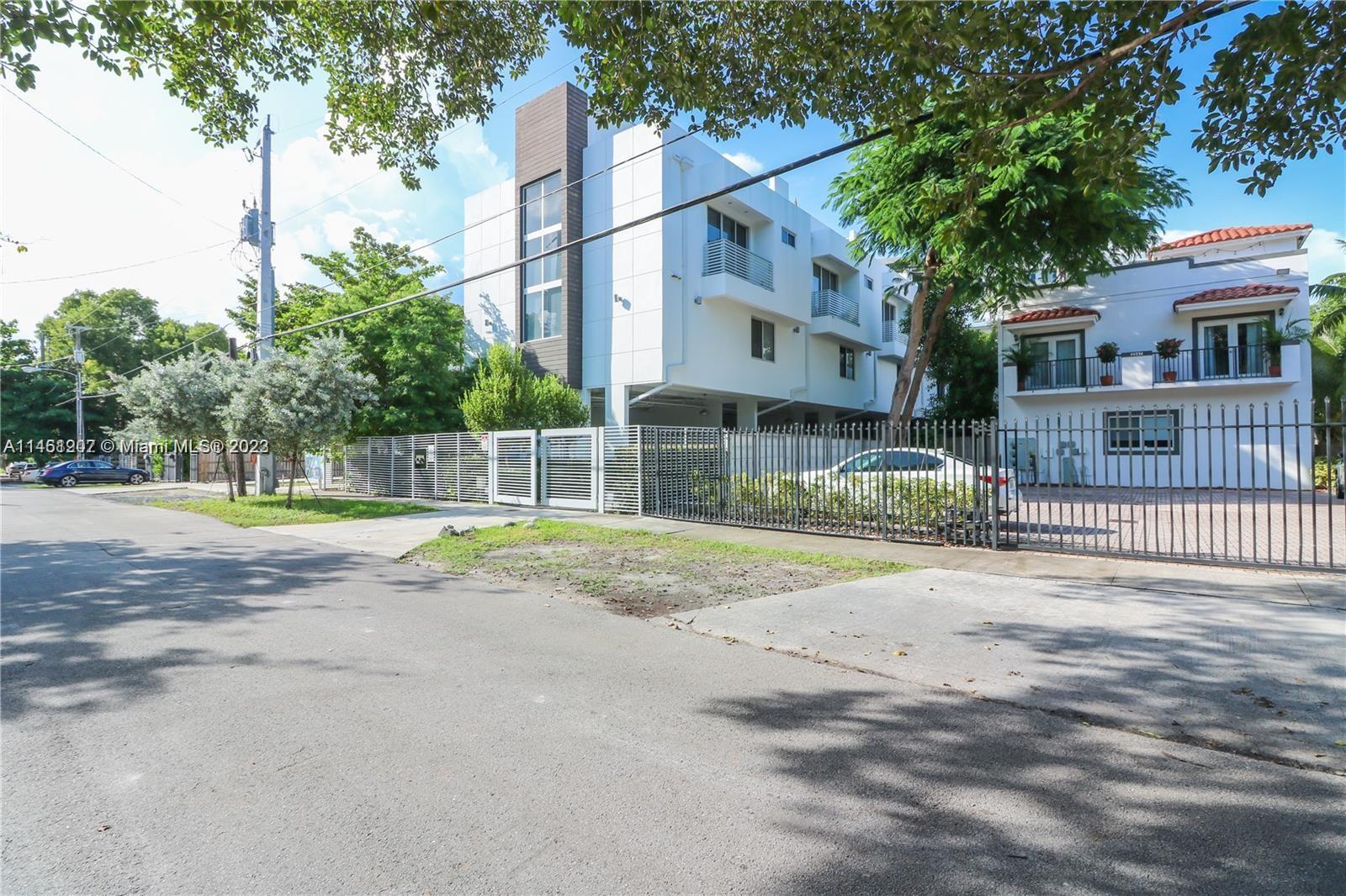 This gorgeous 2-bedroom, 1 - 1/2 bathroom townhome features a large rooftop terrace that provides stunning views of the lush Coconut Grove. It includes private parking and an electric gate for added security. Situated in the heart of Coconut Grove, you can enjoy a relaxing walk to the nearby bars and restaurants. Additionally, it's just a short drive from I95, Downtown Miami, or Miami Beach. The tri-level townhouse comes complete with a convenient in-unit washer and dryer. The property is professionally managed by Management Miami.