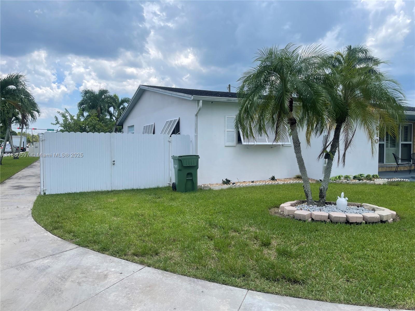 This 3 bed 2 bath corner lot home is your summer oasis. The spacious floor plan seamlessly connects the living and dining areas. The kitchen has plenty of counter space and ample built-in cabinetry for storage. The terrace is equipped with a spacious kitchen for enjoying a delicious family dinner, and also has an additional bathroom convenient for a pool party. The property also has an Airbnb apartment for additional income and plenty of room for your RV, trailer, boat, any other toys. Conveniently located near top schools, shopping centers, and the Redland agricultural area. Easy access to Krome Ave, downtown Homestead, and just minutes from the Florida Keys. NO HOA!!!