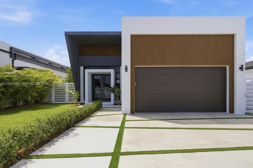 This is not just a home it's an atmosphere. Fully furnished Ultra-modern, clean lines, confident, and quietly provocative, where every space is designed to be felt as much as seen. Every element is intentional, every detail is restrained, yet completely luxurious. inside the space is warm with natural textures, light pours in from every angle from modern fully tinted windows and doors. The kitchen is a statement of seduction with sleek cabinetry, waterfall counter island, upgraded appliances, warm cabinetry and pantry. Matte flooring creates the perfect blend with marble kitchen counters, bathrooms and laundry room. Lutron switches, pool heater, electric car charger, smart toilets, upgraded pool, electronic fence, over 75 palm and fruit trees. Over $400K in upgrades and furniture.