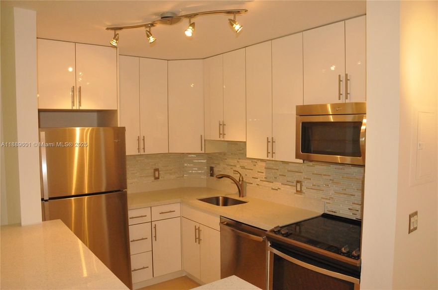 Beautiful 1 BR / 1 BA condo in desirable Lakes of Jacaranda community in Plantation! Features large tile floors throughout, upgraded stainless steel appliances and new kitchen, and a beautiful marble bathroom. Enjoy in-unit washer/dryer and a private balcony with view on the park and lake. Resort-style community with 2 pools, hot tub, tennis courts, gym, jogging trail, clubhouse & more. Prime location near Central Park, Sawgrass Mills, dining, and major highways (I-595, I-75). Water, sewer & trash included. HOA requires min credit score of 650.