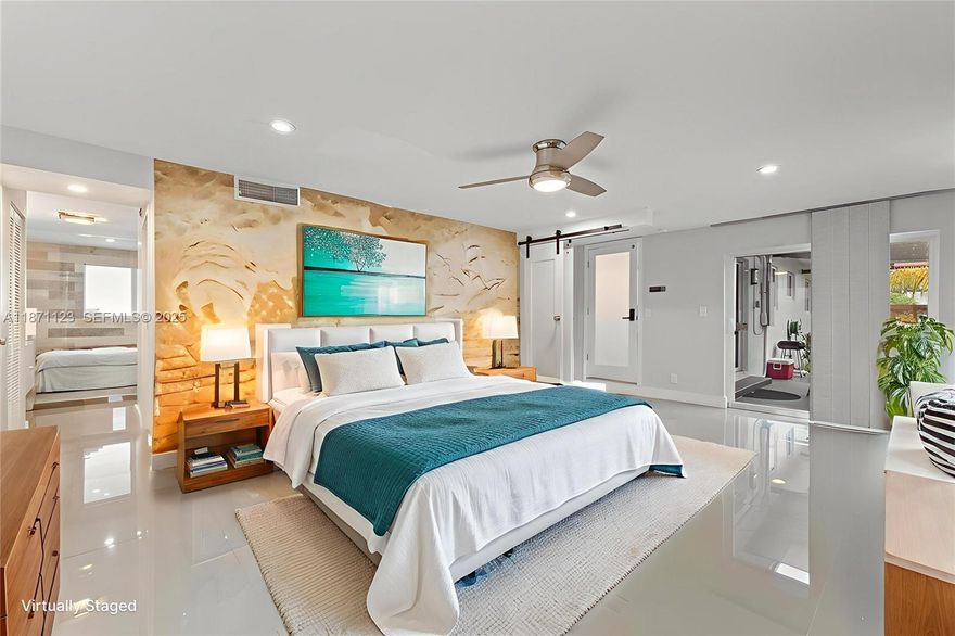 SUN-FILLED SPACES, SMART UPGRADES, AND EFFORTLESS SOUTH FLORIDA LIVING. This Turnkey Corner-Lot Home Offers Bright, Open Living Areas Filled With Natural Light And Sleek Porcelain Tile Throughout. Dual Driveways Provide Ample Additional Parking With Space For Cars, A Boat, Or An RV — A Rare And Valuable Feature.

The Updated Kitchen Features Quartz Countertops, Custom Cabinetry, And Premium Appliances, Creating A Seamless Flow For Everyday Living And Entertaining. The Spacious Primary Suite Serves As A Private Retreat With Its Own Climate Zone, A Walk-In Closet, And A Spa-Inspired Bath Complete With A Wet Room, Multifunction Shower, And Hydrotherapy Microsilk Tub. Dual Climate Zones Provide Comfort Throughout The Home.

Step Outside To A Pergola-Covered Patio And A Backyard With Plenty Of Space To Customize And Make Your Own. Additional Highlights Include Impact Windows & Doors, A 2019 Flat Roof, Updated Systems, And A Tankless Water Heater. Conveniently Located Near Wilton Drive, Beaches, Dining, And Entertainment.