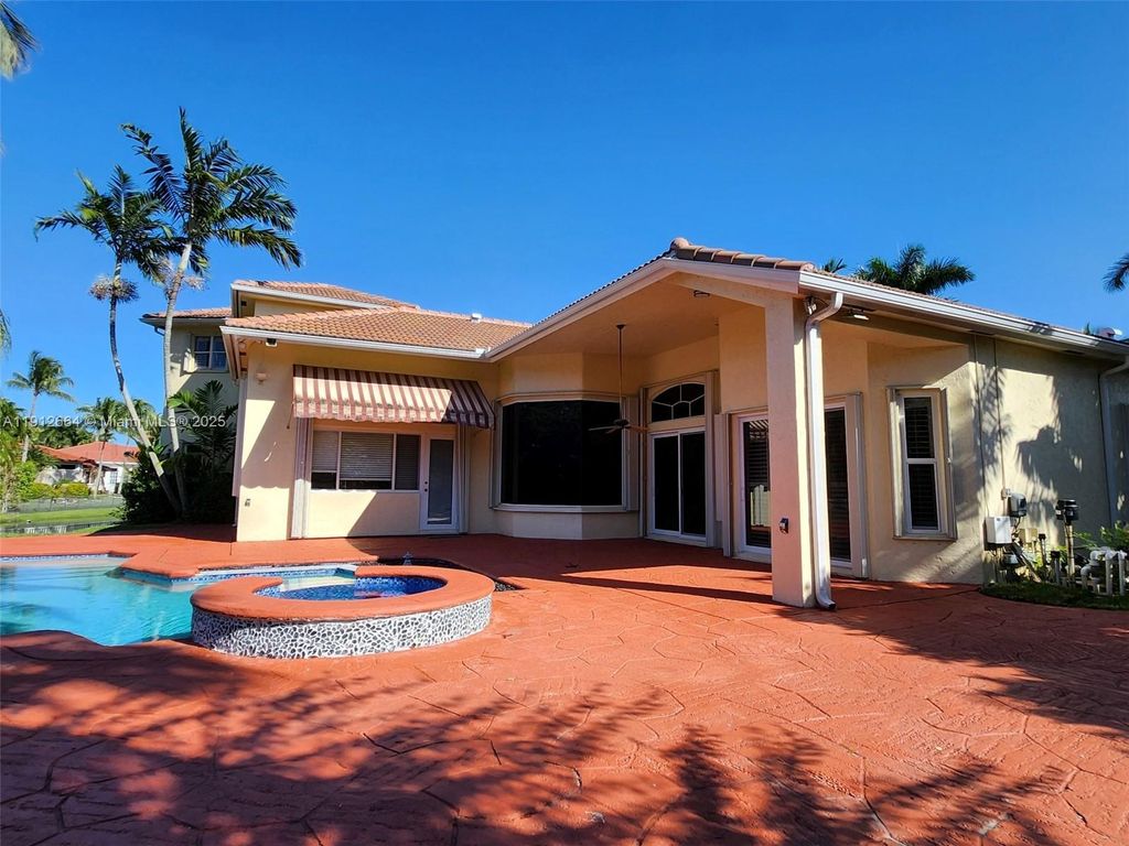 Photo of 321 Windmill Palm Ave, Plantation, FL 33324 (MLS # A11912664)