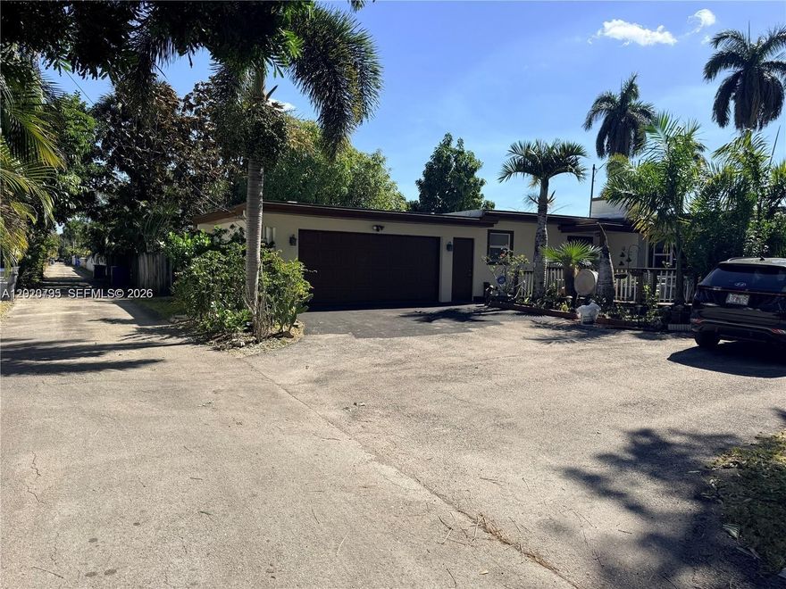 ONE STORY FAMILY HOME NO HOA, THREE BEDROOMS, THE THIRD BEDROOM IS IN THE GARAGE WITH PRIVATE ENTRANCE , 2.5 BATHROOMS , 2 ATTACHED CAR GARAGE PLUS PARKING SPACES. WOOD CABINTES KITCHEN WITH GRANITE COUNTER TOPS, SPACIOUS LIVING AND DINNING ROOMS ,a brand NEW ROOF WITH INSOLATION installed in 2025, IMPACT WINDOWS AND DOORS, providing peace of mind for years to come. . And when it's time to relax and unwind, the world-renowned Hard Rock Casino and the pristine beaches of Hollywood are just a short drive away. surrounded by lush landscaping ........ This home truly offers the perfect blend of comfort, style, and location. WALKING DISTANCE TO RRESTAURANTS ,SHOPPING CENTER, Schedule a showing