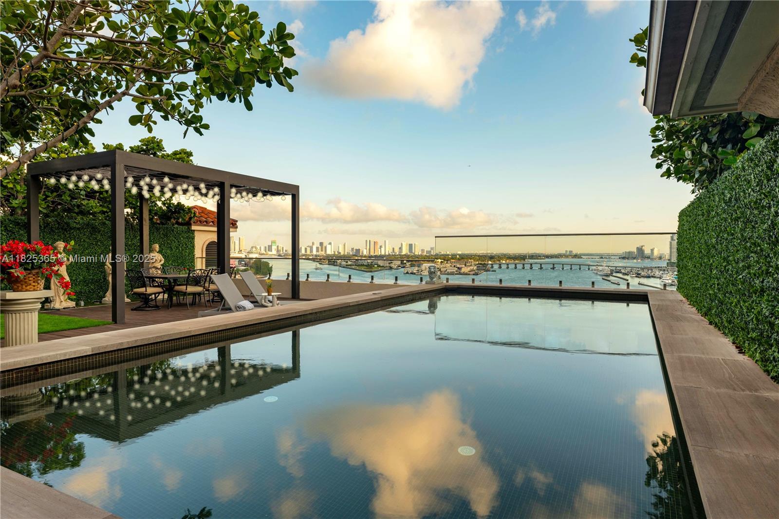 Experience this legacy 9,947SF LPH at Palazzo Della Luna on Fisher Island. Offering 7 bds, 8 fbs, and 2 hbs, Feel the expansive spaces with breathtaking views of the ocean, bay, and city skyline, seamlessly connecting to multiple terraces. Inside, discover gallery walls, oak floors, and a Boffi kitchen equipped with Miele and Sub-Zero. The primary suite features a fireplace, marble bath, lounge area, and dual walk-ins. Unwind and entertain on the expansive 2,500+ square foot coveted private rooftop with a pool, kitchen, and living area all framed by panoramic vistas. Residents enjoy exclusive resort amenities spread over 216 acres, including a golf course, a marina, and much more. This is luxury living at its finest. A legacy home to cherish, an investment to appreciate.