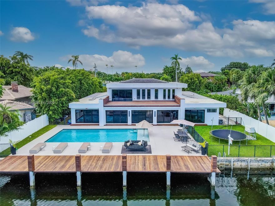 2015 total rebuild, 5400SF, 6 bedrooms, 7 baths. 15,000 SF lot. Gated 2 car garage 9’ entry pivot door Brazilian Ipe hardwood canopy Open concept living 8 gas burners Bosch wall ovens SubZero refrigeration Oversized island w/ double SubZero freezer drawers ice maker 2 dishwashers Upstairs all primary bedroom oversized sitting area w/ spa bathroom 8X8 glass shower, 2 sinks, relaxation tub, 2 enclosed WC, terrace overlooking pool, waterway  .34 acre lot fenced, gated. Resort-style pool w/ auto-water fill deck jets and bubbles w/ beach deck, in-water umbrella Dock Brazilian Ipe wood Generator Impact glass 2 tankless gas water heaters 16 cameras Sound system 3 AC zones linear diffused vents Room for 2 washers, 2 dryers.