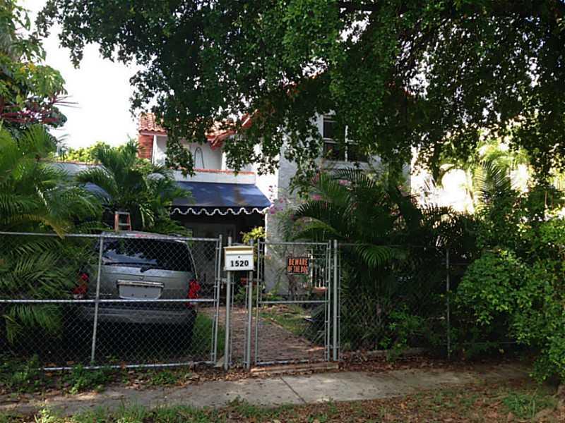 Solid oak wood floors through out the house with tile in the foyer area and marble in the kitchen. Yes, this house needs help and lots of it but the potential is there for this Miami style home. Spacious back yard and the street is quiet.