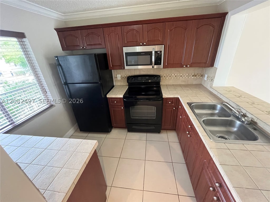 Photo of 8560 N Sherman Cir #308, Miramar, FL 33025 (MLS # A12082497)