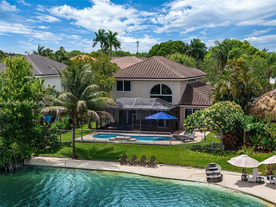OPEN HOUSE JUNE 6th 11am-1pm. Most lake homes give you a view. This one gives you a beach + $300k of upgrades. A rare private sand shoreline on your own lake makes this one of the most unique waterfront properties in all of West Pembroke Pines. Spend your mornings on the covered patio watching the water, then take a walk on the miles of trails Chapel Trail is known for. This neighborhood sells itself.

Inside, 2,309 square feet of completely reimagined living space across 4 bedrooms and 2.5 baths. The primary suite is on the ground floor, a layout that is genuinely hard to find at this price point. Everything you see has been touched. New tile and baseboards downstairs, fresh carpet upstairs, fully remodeled kitchen, all new bathrooms, custom vanity and designer shower in the primary. Stone accent wall adds a detail you just do not see in homes at this price.

New roof (2023), impact doors and windows, updated plumbing and electrical, stainless steel appliances under two years old. The pool was resurfaced in 2024 with new tile and the heater is still under warranty. A separate laundry room and a two-car garage round out a home that functions as well as it looks.

Top-rated schools, including one of Broward's best high schools, are right in the district. Turnkey, waterfront, with a sand beach in your backyard. Contact us to set up your private showing.