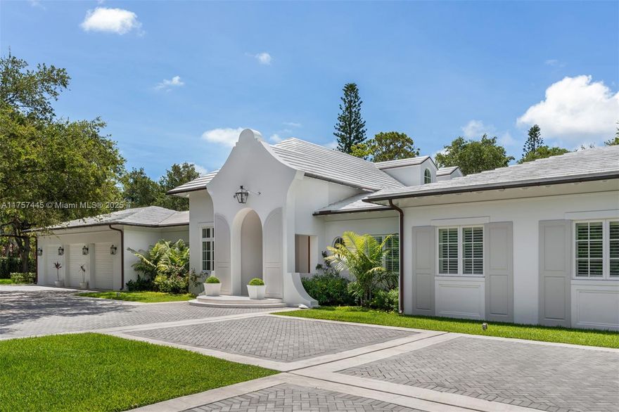 Nestled behind a private gated entrance in the heart of Pinecrest, this breathtaking estate exudes elegance and modern sophistication. With 5 bedrooms & 5.5 bathrooms, this home welcomes you with soaring vaulted ceilings, & a spacious great room that seamlessly integrates the living areas & kitchen into a beautifully open layout. The chef’s kitchen is equipped with a Lacanche Citeaux French range, dual Sub-Zero refrigerators, 2 Miele dishwashers, & a dedicated bottle wine storage room. The primary ste features a cozy sitting area, a custom walk-in closets, & a spa-like bathroom with dual sinks, a soaking tub, & a walk-in shower. Step outside to a lush backyard oasis, where a covered terrace with ambient lighting, a comfortable sitting area, a summer kitchen, & a sparkling pool.