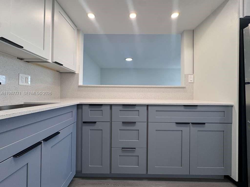 Photo of 455 Golden Isles Dr #203, Hallandale Beach, FL 33009 (MLS # A11987771)