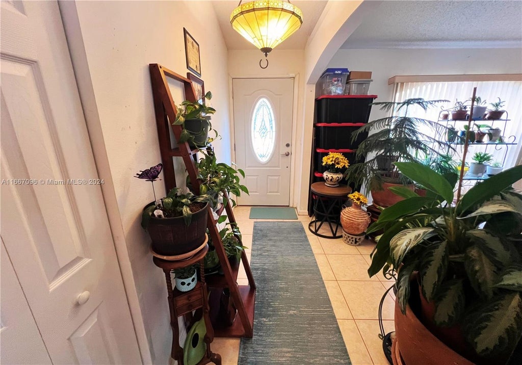 Photo of 1598 SW Curry St, Port Saint Lucie, FL 34983 (MLS # A11667096)