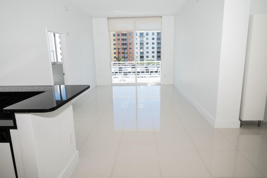 Remodeled all white Penthouse in The Venture at Aventura West! Bright and spacious 2 bed / 2 bath with soaring ceilings, open kitchen with black granite countertops, white tile floors, waterproof vinyl in bathrooms, and split floor plan. Features brand-new bathrooms, new A/C, new water heater, washer/dryer in unit and generous closets. Enjoy private balcony with pool views. High-impact windows. 1 assigned garage space + Valet Parking.  Pristine building with Zero Special Assessments, 24-hr concierge/security, 2 infinity pools, cabanas, sauna, spa, fitness center, business center, theater room & more. Prime location near Aventura Mall, dining, shopping, and beaches. Excellent for investment or owner-occupied. Walk to supermarkets, cafes, parks, and enjoy the vibrant Aventura lifestyle. Easy to show!