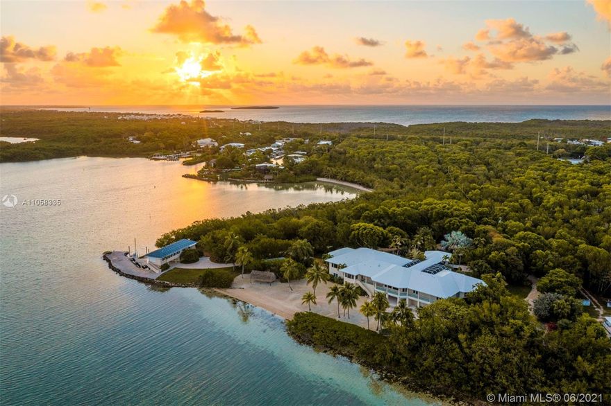 Experience Absolute Paradise! One of Florida’s most special waterfront estates. Florida Keys Tropical Compound spans 14.5 Acres with over 1,000 ft. of Private Beaches & a 1/4 mile grand entrance surrounded by beautiful exotic trees. Award-quality tropical orchids & plants abound and an impeccably curated nature trail leads to an ultra-private beach. Primary home’s grand entrance welcomes with natural coral features & a footbridge, rock waterfalls and Koi ponds. Expansive water views, 10-12 Ft.Ceilings, Library, Theater, Spa & Wellness room, Elevator & Chef’s kitchen. 8 bedrooms, 14 bathrooms including Boathouse and Villa guest homes. Private boat dockage, catering facilities, & full generator. Daily spectacular sunsets over Florida Bay & the National Park. Arrive by sea plane, boat, or car