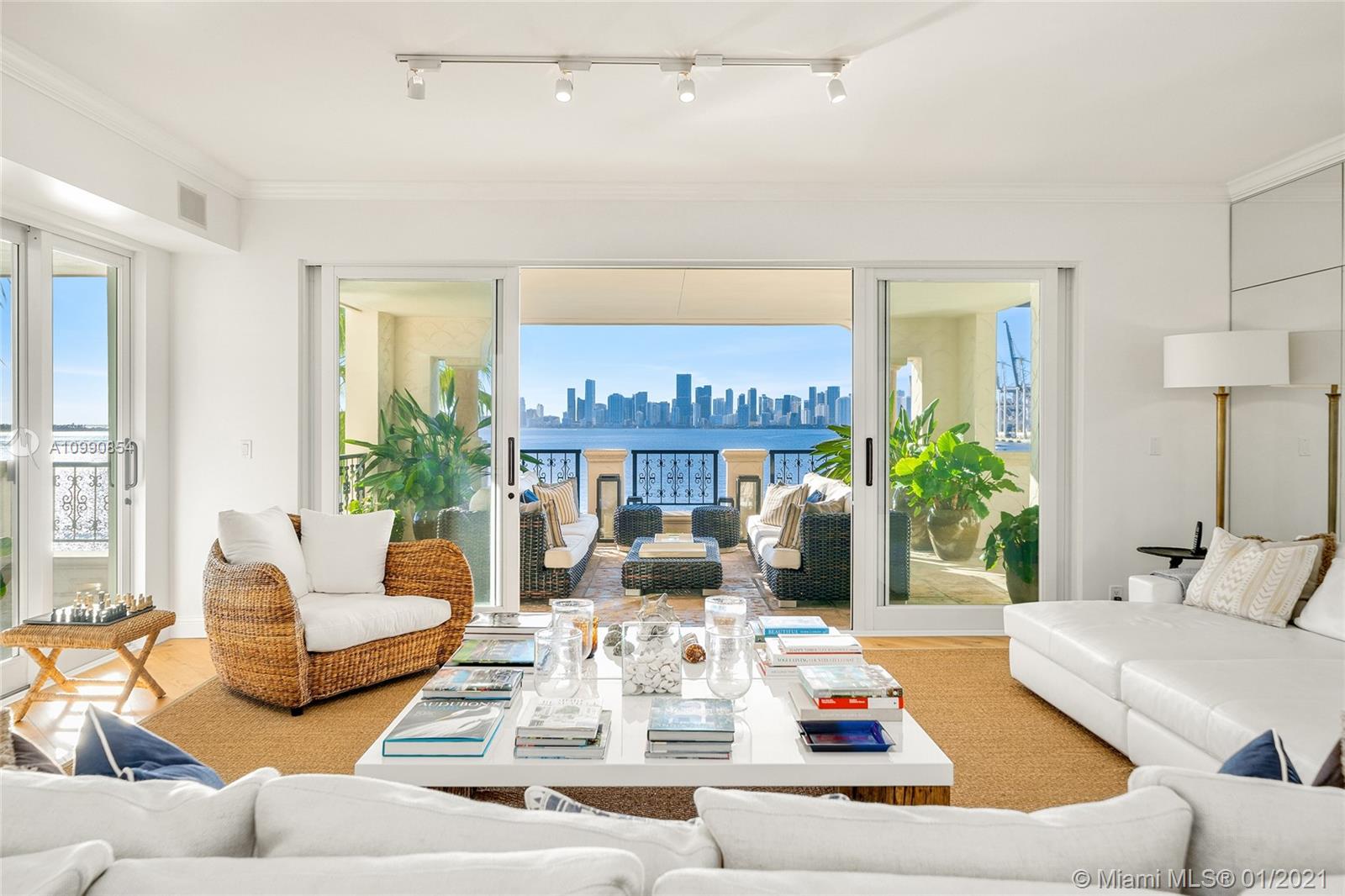 This stunning contemporary 4BR/4+1BA Bayview corner unit offers 4,010 SF of luxury, & 4 terraces w/amazing direct views to the downtown Miami skyline, Biscayne Bay, Virginia Key, over Fisher Island & Miami Beach. Unit features wide plank engineered oak wood floors, spacious open living room w/bar & separate dining area surrounded by walls of glass w/direct access to the bayside terrace. The gourmet kitchen sports a center island, brand new top-of-the-line Sub-Zero refrigerator/freezer, Wolf cooktop, wine chiller, plus custom cabinetry & separate breakfast area. Spacious private principal suite w/large new walk-in closet, premier Stark carpeting & principal bathroom w/walk-in rain shower & sunken spa tub. 3 other BRs are each spacious w/en-suite bathrooms. 5-star Fisher Island amenities.