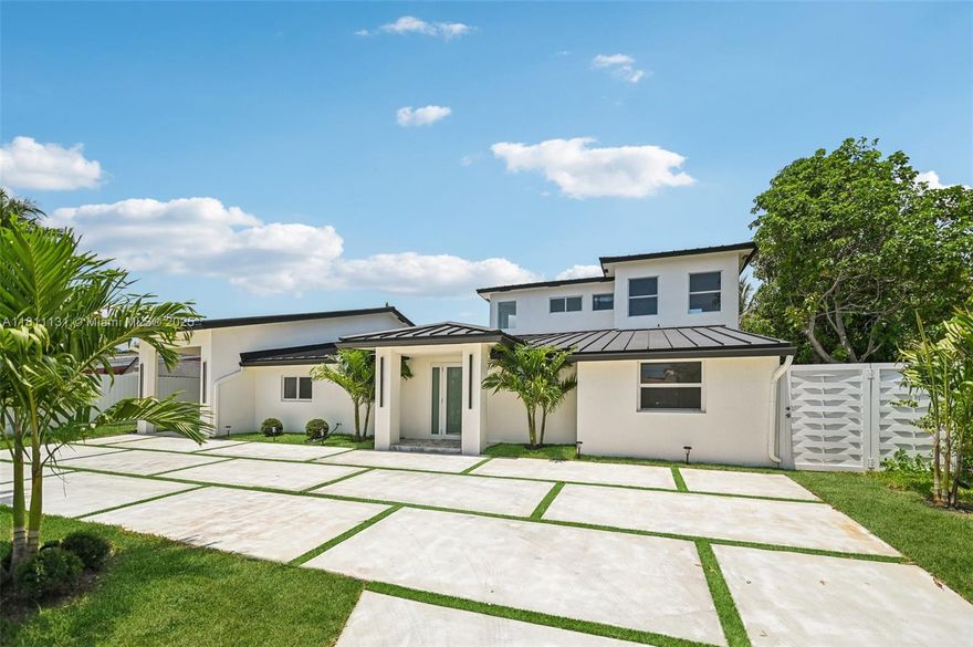 Nestled in a charming neighborhood with tree-lined streets and parks, this home is just 15 min from Dwntwn & Ft Laud Bch. This expansive 5-bed, 4-bath, 4,668 sq. ft. residence features 2 primary suites & 3 en-suite baths. Enjoy an open island kitchen, butler's pantry, & seamless indoor/outdoor living w/ a pool, deck, & 72-ft boat dock. Designed by MIANSOLULA, the home boasts custom matte white cabinetry, imported European quartz countertops, & unique knobs and faucets by Homary & Haliwu. Bathrooms feature European Joshua Tree-inspired vanities, premium pipe fittings, BWE oil-rubbed bronze faucets, & Maximo Ceramic Italian porcelain tile. LED lighting adjusts from warm to bright, complemented by solar spotlights on house exterior. Ideal homeowners seeking space & a nautical lifestyle.